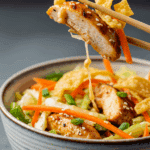 A delicious serving of the finished Grilled Asian Chicken Salad in a bowl.