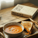 comforting meal of creamy Tomato Bisque served with a gooey grilled cheese sandwich for dipping.