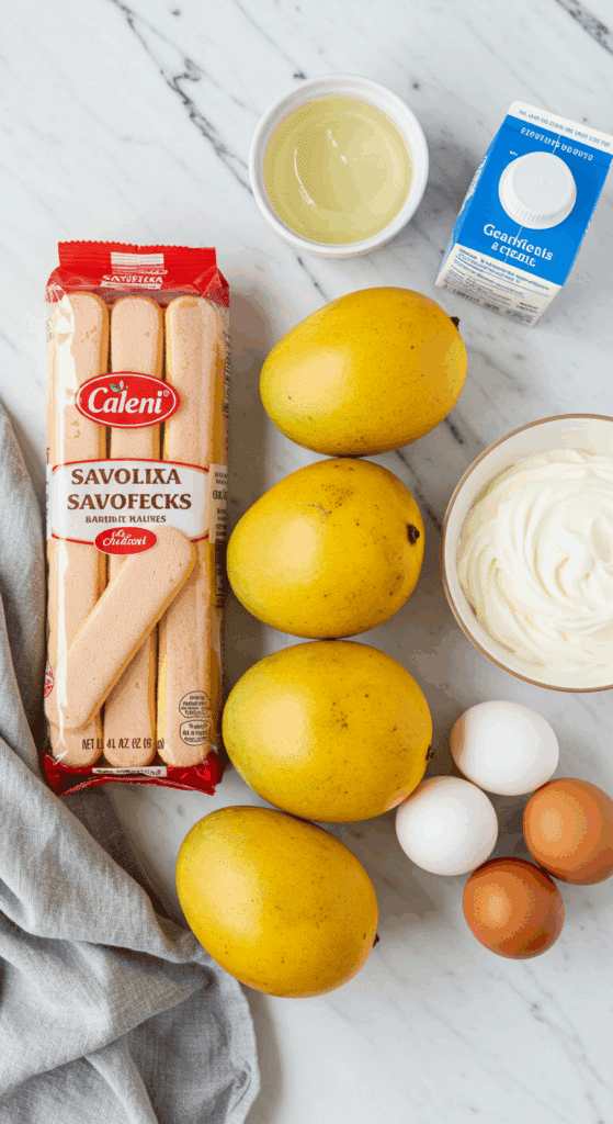 The fresh, elegant ingredients for the Mango Charlotte Cake recipe.