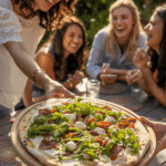 A person serving the finished Grilled White Pizza appetizer at a party.