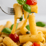 A forkful of the finished pasta with No-Cook Tomato Sauce.
