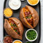 A beautiful and fun "sweet potato bar" with a variety of sweet and savory toppings.