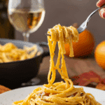 A beautiful plate of homemade, creamy Butternut Squash Alfredo pasta being enjoyed for a cozy dinner.