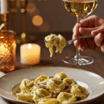 An elegant bowl of homemade, creamy Tortellini Carbonara being served for a sophisticated dinner.