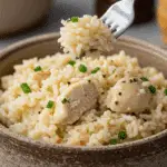 A cozy bowl of homemade, creamy Coconut Chicken and Rice being served for a casual family dinner.