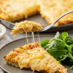 A healthy slice of homemade, cheesy Cauliflower Crust Pizza being served for a casual family dinner.